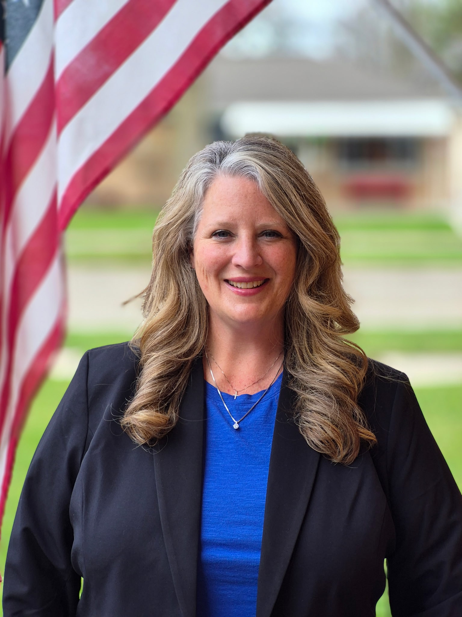 Julie Leonardi with an American flag